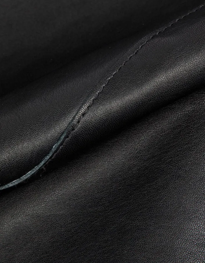 Veste cuir noir bavolet et poche biais Femme